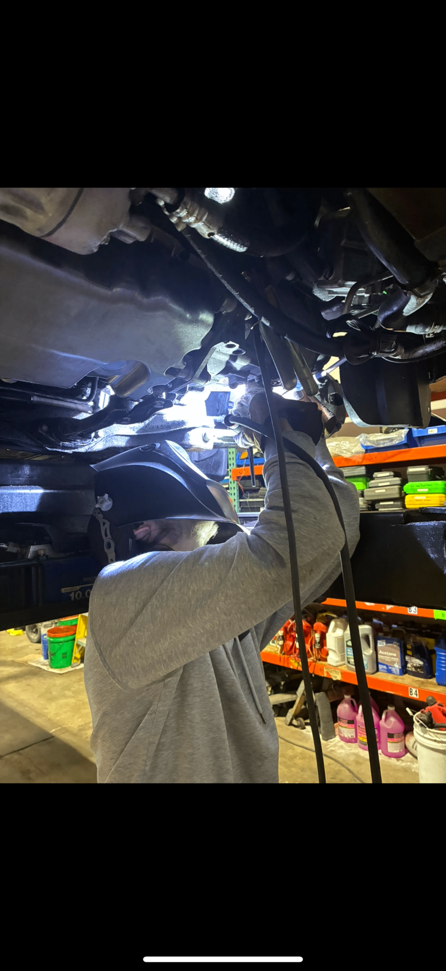 JW2 welder at work under a vehicle